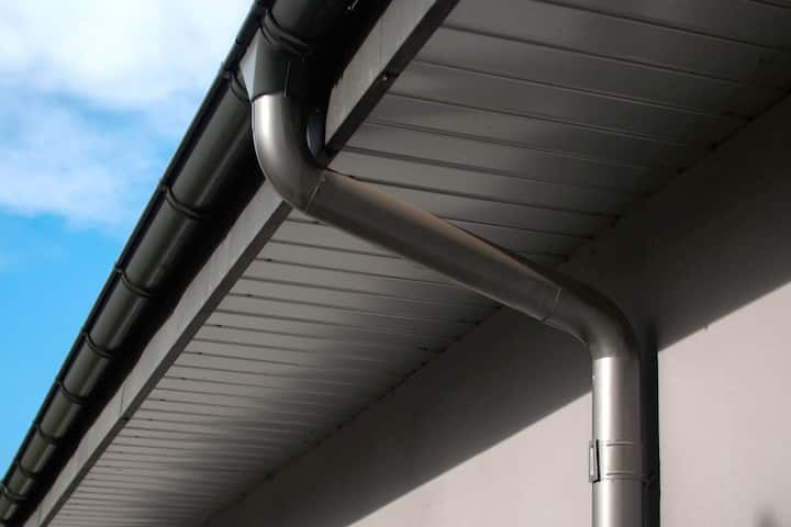 Corrosion-resistant galvanized gutters installed on a commercial building in Spartanburg